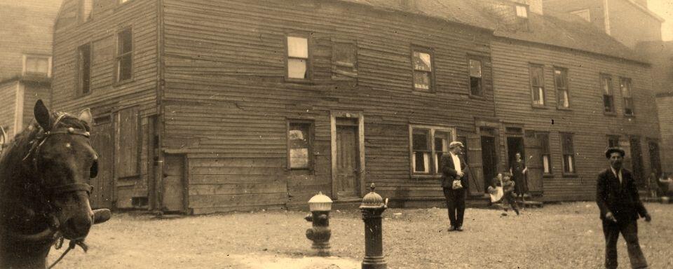 Explore the pre-war conditions and post-war expansion of St. John's